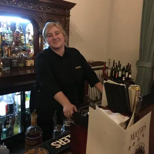 a woman behind the bar