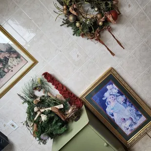wreaths and framed pictures