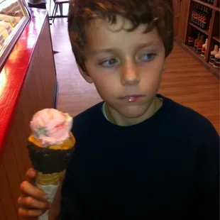 Double scoop, peppermint and orange sherbet with a dipped chocolate Oreo cone
