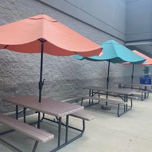 tables with umbrellas