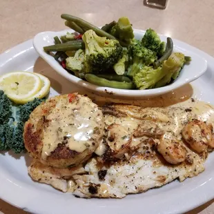 a plate of chicken, broccoli, and a bowl of gravy