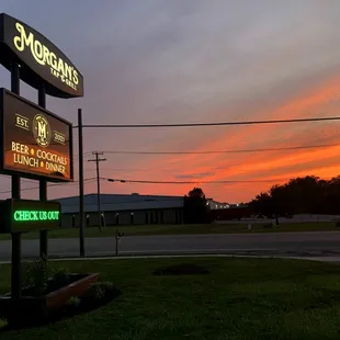 a neon sign for morgan's tap and grill