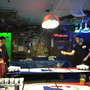 a man serving beer to a group of people