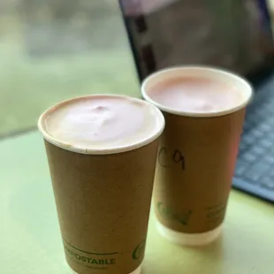 two cups of coffee and a laptop