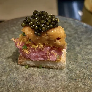 Toro / "Tuna Belly" on Toast (+15 Hokkaido Uni) with dehydrated egg yolk and caviar