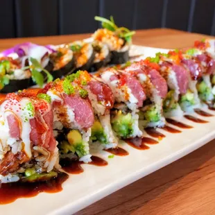 Crazy Night: fresh water eel, cucumber, avocado, topped with krab salad, fresh tuna, wasabi mayo, unagi sauce, fish egg ($17).