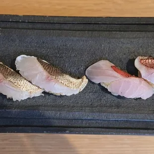 From right to left: Golden Eye Snapper,  Barracuda