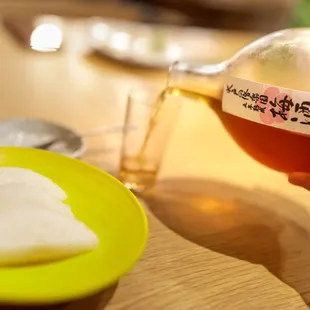 Delicious dessert sake (part of $65 pairing) with pear slices (I believe)