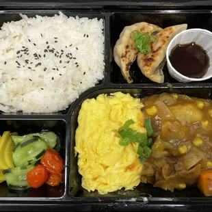 OMU CURRY
Japanese Curry and Omelette, with a side of two pork dumplings