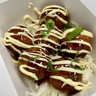 TAKOYAKI
 Octopus Balls: Famous Japanese street food Deep fried and drizzled with Japanese mayo and sweet and savory sauce