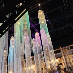 The ceiling is decorated with contemporary lanterns.