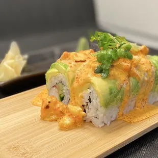 a close up of a sushi roll on a cutting board