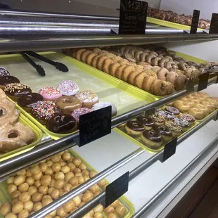  a variety of donuts on display