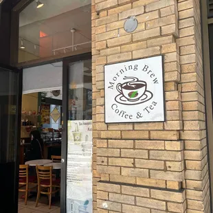 the entrance to a coffee shop