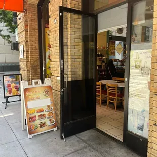 the entrance to a coffee shop