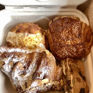 Clockwise from left: Pineapple marscapone scone, chocolate croissant, blondie, and almond croissant