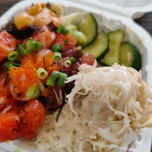 Two choices: Tobiko King Salmon and Shoyu Limu Ahi... With uni (add-on)... On a bed of shredded cabbage