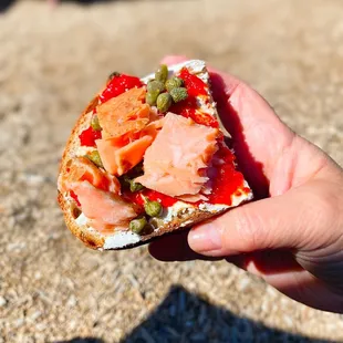 A toast I made from my order of smoked salmon and salad with capers, pepper jam, whipped cream cheese