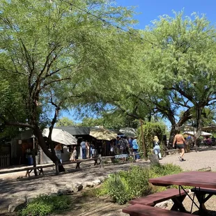 a group of people walking through the park