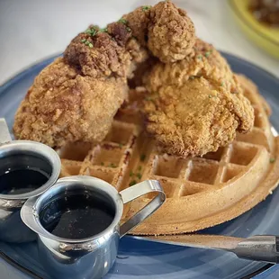 Chicken &amp; Waffles: one piece bone in thigh was bland, couldn&apos;t tell what the other piece was (battered fatty skin?) inedible.