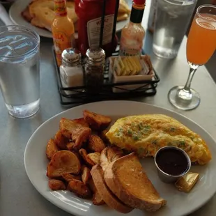 Mile high omelette, crispy potatoes and sour dough toast. The jam was sooo good!