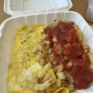 Steak &amp; Cheese Omelette w/ home fries - heavy on the ketchup.