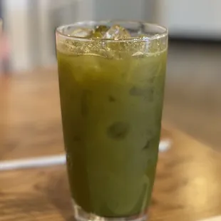 a green drink in a glass