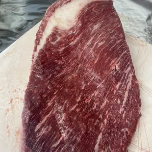 a piece of meat on a cutting board