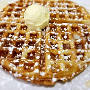 a waffle with a scoop of ice cream