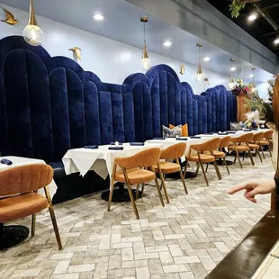 a restaurant with tables and chairs