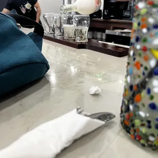 a person pouring something into a glass