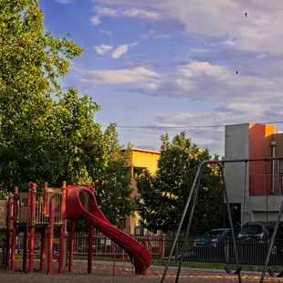 Two hot air balloons are drifting overhead