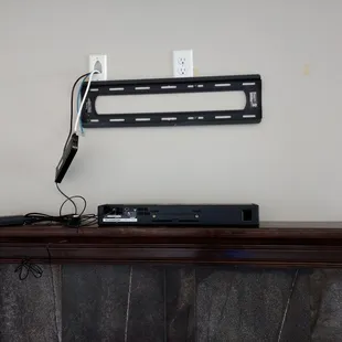 Custom fireplace tv mount with wire concealment