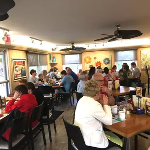 a large group of people sitting at tables