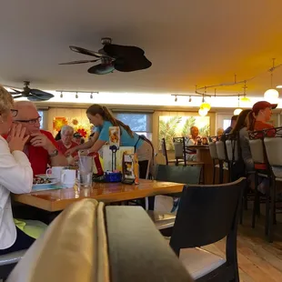 a group of people eating at a restaurant