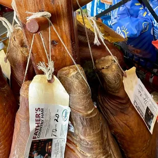 ausages hanging from a rack