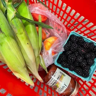 Fresh corn on the cob, peaches, blackberries and Carolina reaper salsa