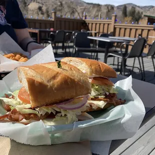 a sub sandwich on a paper plate