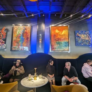 a group of people sitting around a table