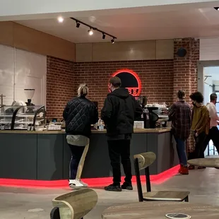 people standing in a coffee shop
