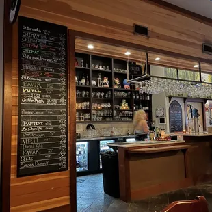 a bar with menus on the wall