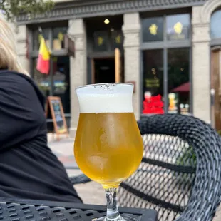 a glass of beer on a table