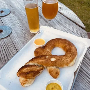 Beer pretzel, shaped like Mortal Key logo, served with incredible grain mustard and savory cheese sauce.