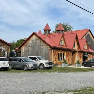 several vehicles parked in front of the building
