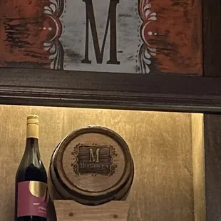 a bottle of wine and a barrel of wine