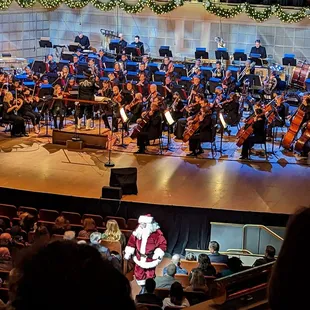 Everyone singing 12 days of Christmas. When it gets to 5, Santa gives the mic to an audience member! Fun!