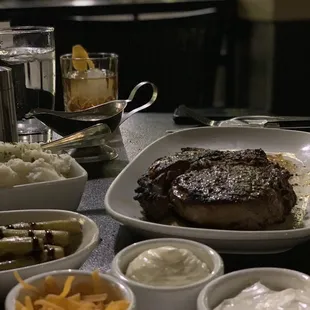 Ribeye, asparagus, mashed potatoes and dressings