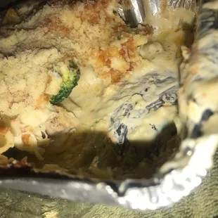 Under the cheese