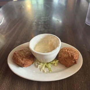 Crab cakes with a shrimp cream sauce