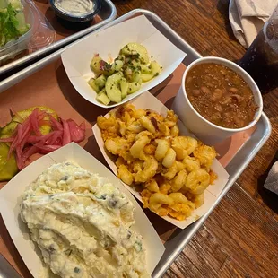 Potato salad, cowboy beans, macaroni and cheese and cucumber salad